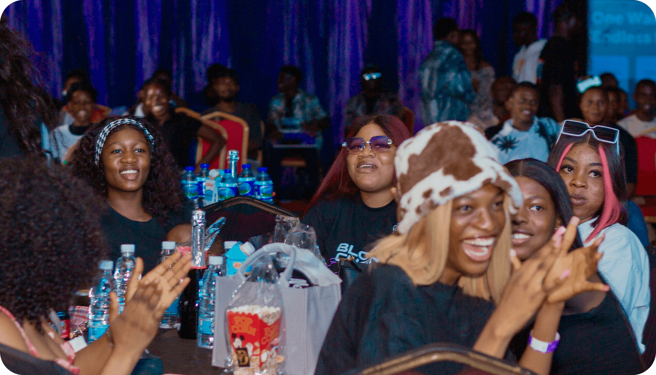 Happy event attendees enjoying the show